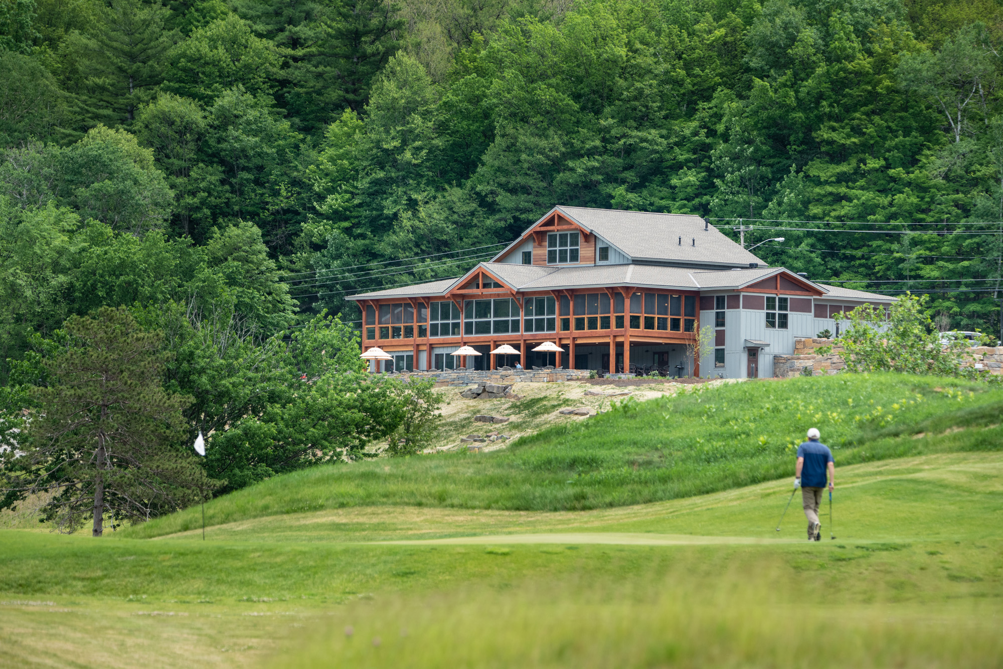 golfer facing clubhouse