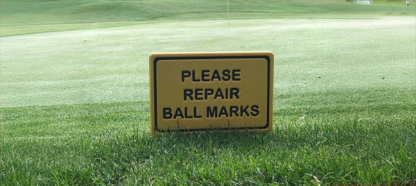 please repair ball marks sign